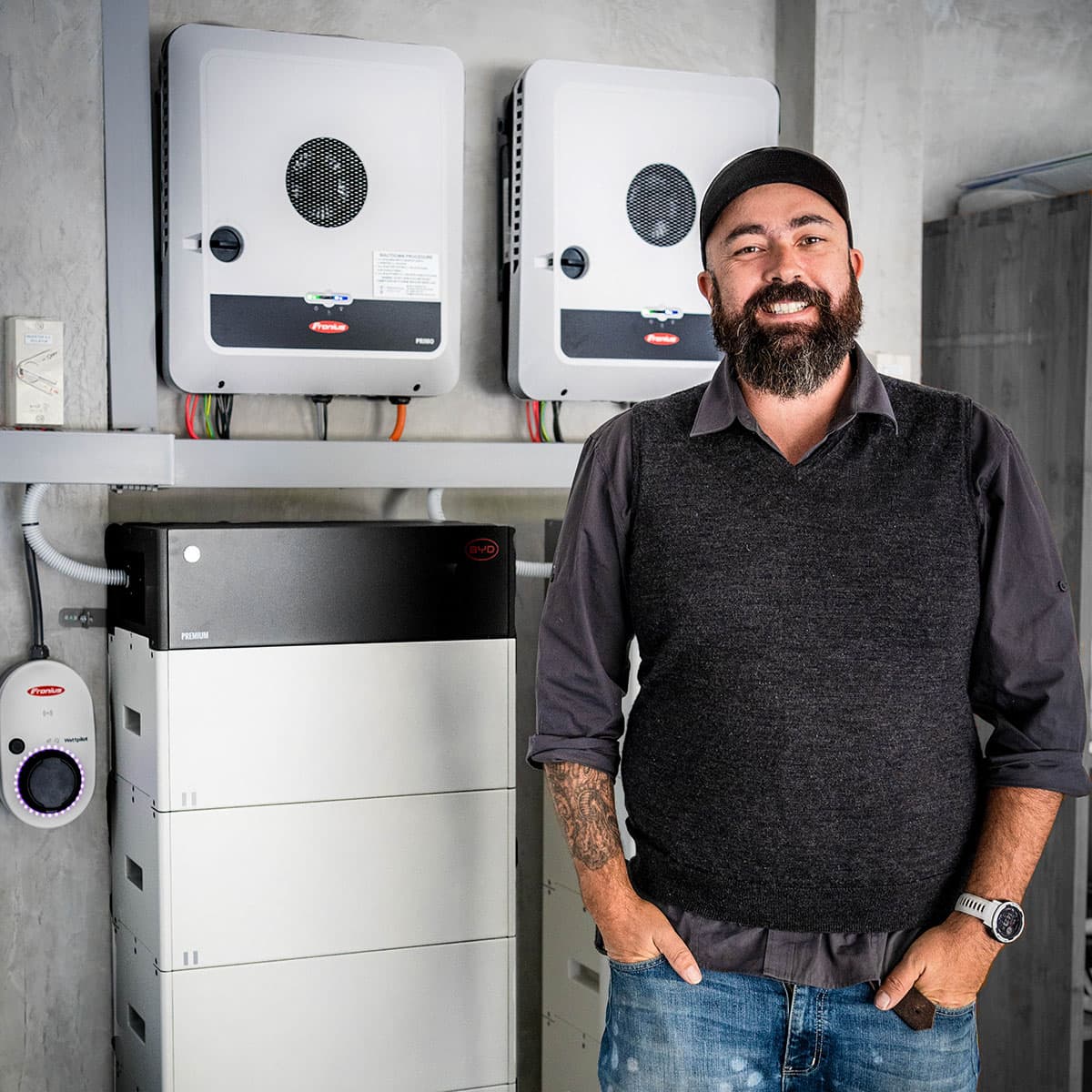 Aurion Energy technician with an installed battery system